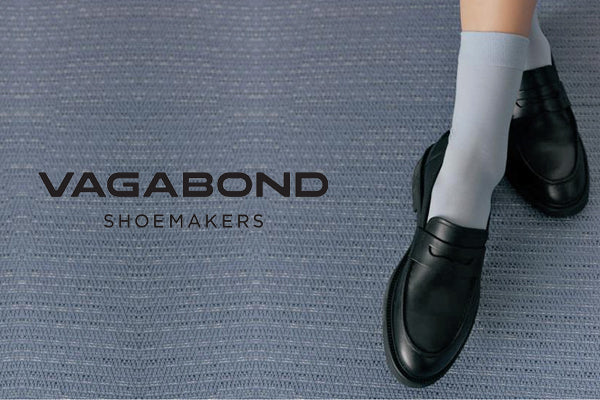Vagabond Shoemakers Alex W Black Leather Women's Loafer Slip On Harry's Shoes Upper West Side NYC Lifestyle Woman's Feet On Blue Carpet And Logo