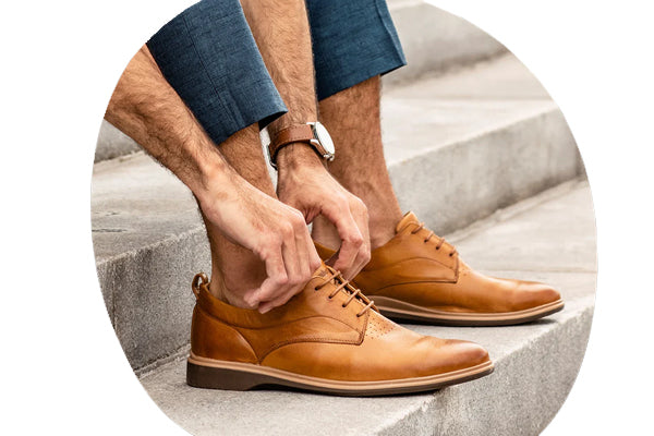 Amberjack Men's Original Leather Oxford Harry's Shoes Upper West Side NYC Lifestyle Man Tying Shoes On Light Grey Stepss