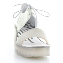 Load image into Gallery viewer, Silver and Off White With Transparent Sole Fly London Women&#39;s Bilu465fly Leather And patent Lace Up Wedge Sandal Front View
