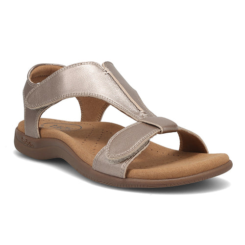Champagne Grey With Brown Sole Taos Women's The Show Metallic Leather Shield T Strap Casual Sandal