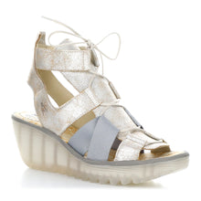 Load image into Gallery viewer, Pearl Light Gold And Grey With White Sole Fly London Yaca413Fly Metallic Leather And Elastic Strappy Lace Up Sandal Wedge Profile View
