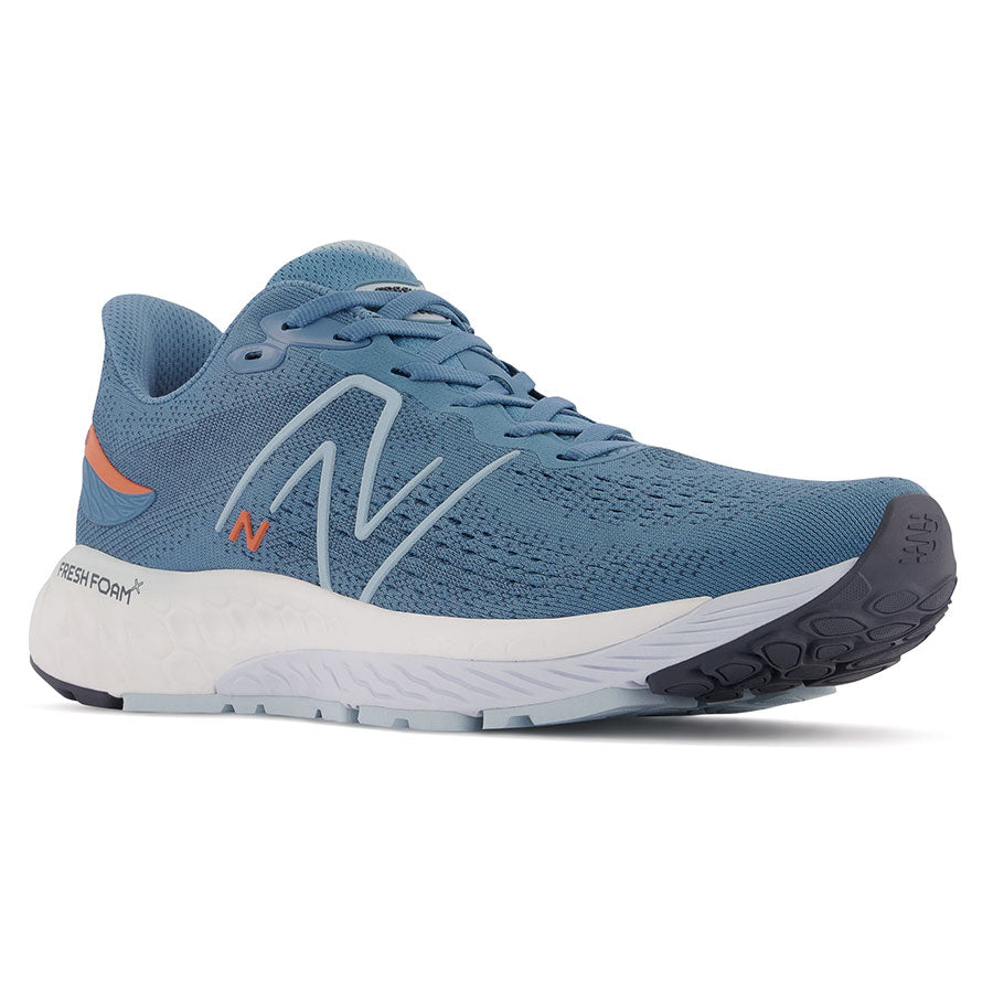Blue With Orange And White Sole New Balance Men's Fresh Foam X 880V12 Knit Athletic Sneaker Profile View